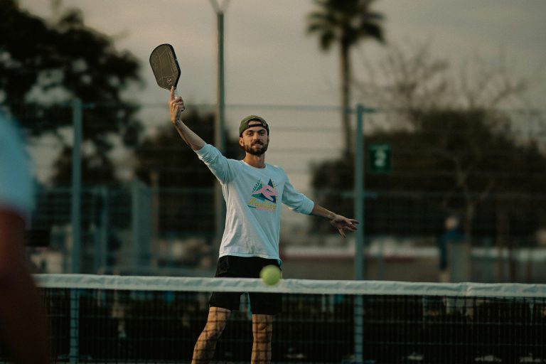 Former tennis player playing pickleball showing the best pickleball paddles