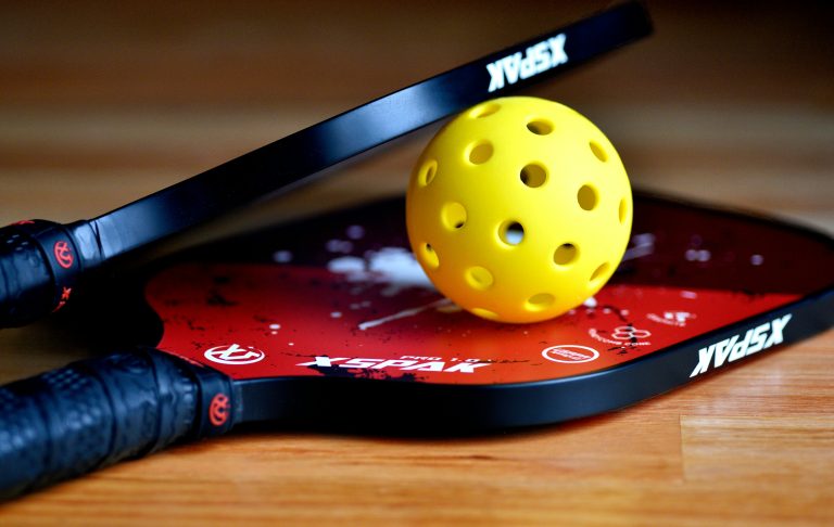 pickleball paddles sets showcased on hardwood