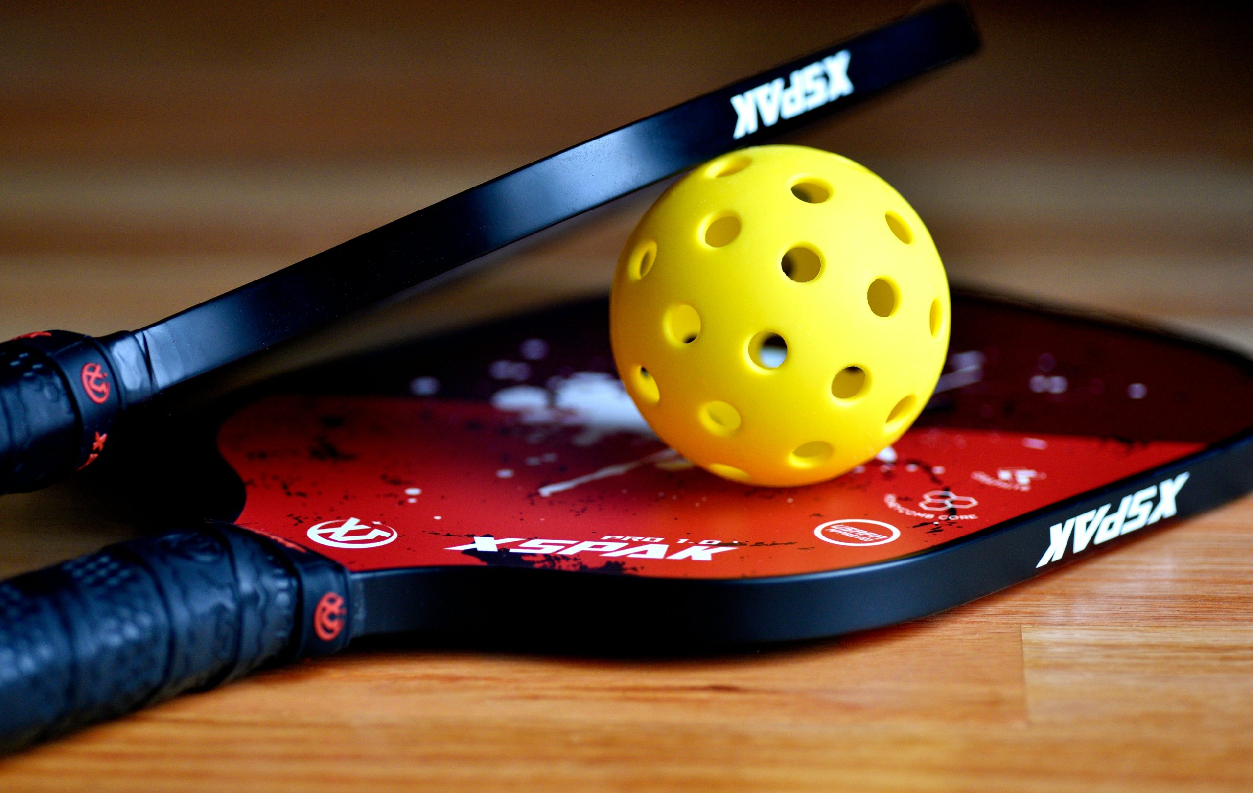 pickleball paddles sets showcased on hardwood