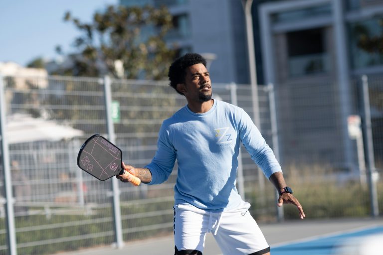 pickleball player using one of the best carbon fiber pickleball paddles of 2025