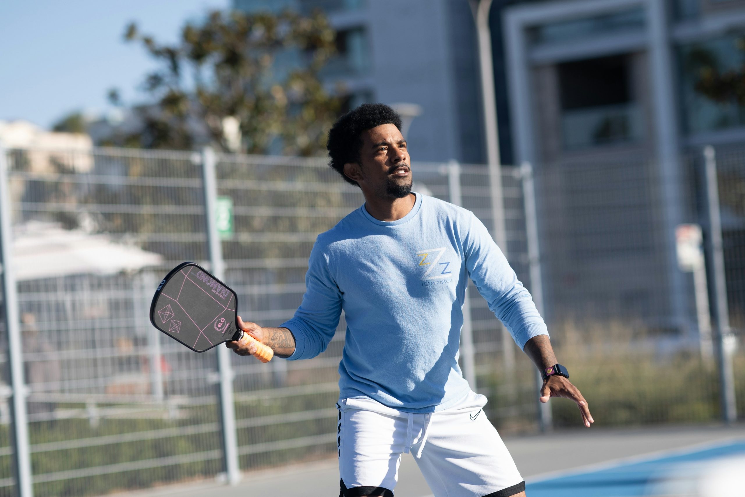 pickleball player using one of the best carbon fiber pickleball paddles of 2025